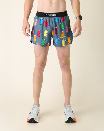 Runner is wearing ChicknLegs in the men's 4 in split running shorts with a back pocket and inner liner pocket. The print has porta pottys all over it in various colors such as red, yellow, orange, green, pink, and blue.