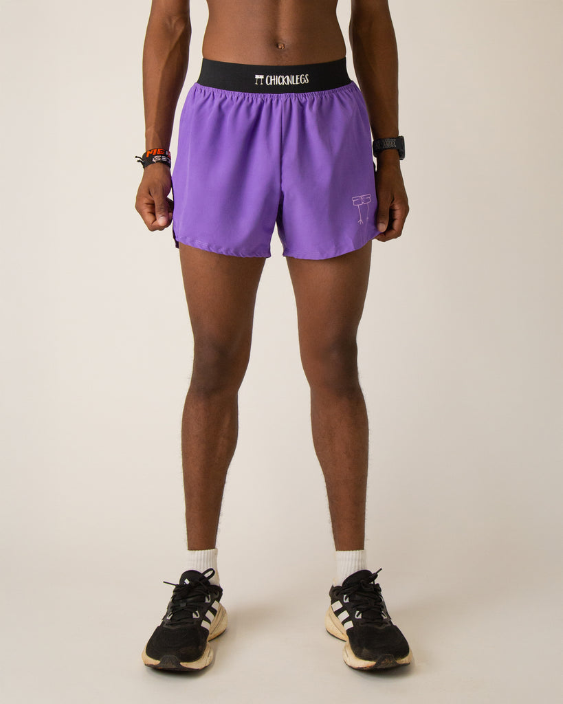 Runner is wearing ChicknLegs in the men's 4 in split running shorts that has a back pocket and inner liner pocket. The print is a solid purple color.