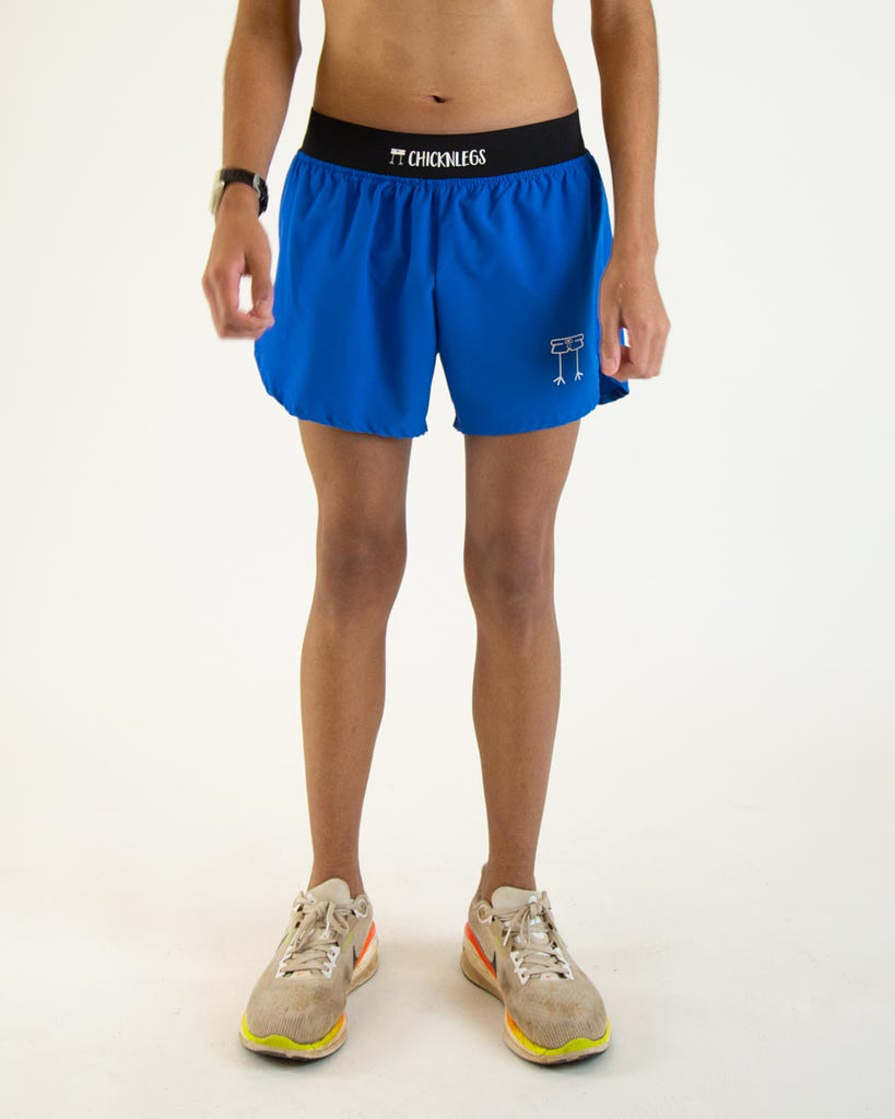 Runner is wearing ChicknLegs in the men's 4 in split running shorts in the royal blue design.