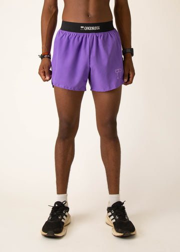 Model wearing Chicknlegs in mens 4 inch split running shorts in the purple design, facing front
