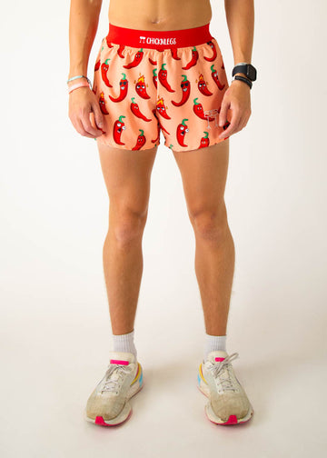 Model is a runner wearing Chicknlegs 4 inch split running shorts in the Chili Pepper design, facing front.
