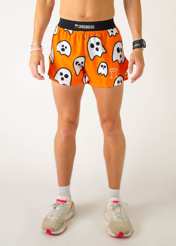 The model is a runner wearing Chicknlegs men's 4 inch split running shorts in the Ghost design, facing front.
