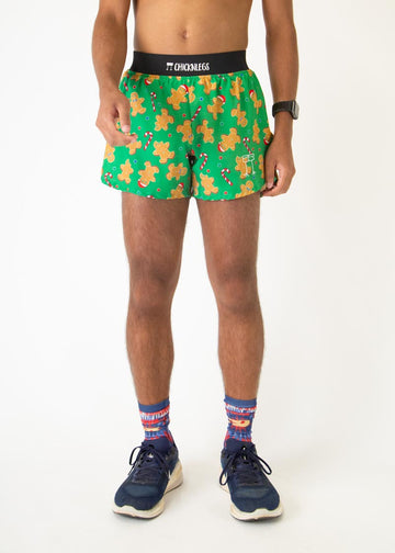 The model is a runner who is wearing Chicknlegs in men's 4 inch split running shorts in the Gingerbread Men's Gingy's Revenge design, facing front.