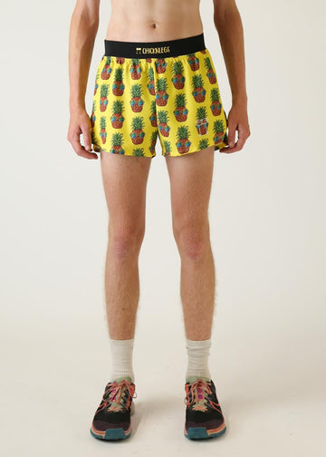 Model wearing Chicknlegs men's 4 inch split running shorts pineapple express design front view