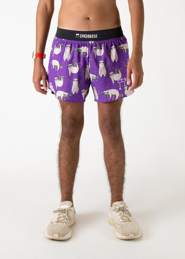 The model is a runner who is wearing Chicknlegs men's 4 inch split running shorts in the sloth design, facing front.