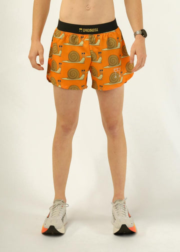 Model is wearing Chicknlegs men's 4 inch split running shorts in the snails design, facing front.