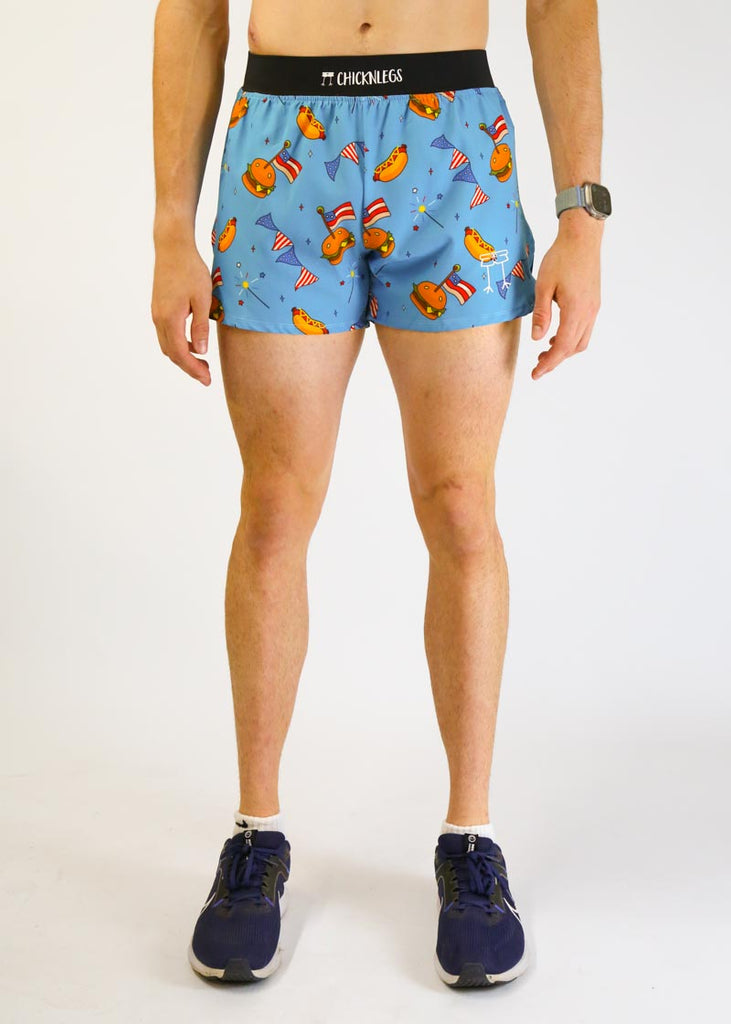 Model wearing chicknlegs men's 4 inch split running shorts in the usa cookout design facing front