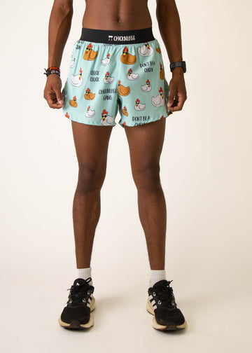 Model wearing Chicknlegs in mens 4 inch split running shorts in the swaggy chickns design, facing front
