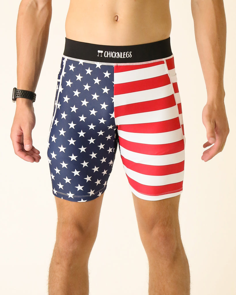 Runner is wearing ChicknLegs in the men's 8 in half tights with pockets in the USA State Flag design. The print has red, white and blue on it with stars. Great for running for people who love America.