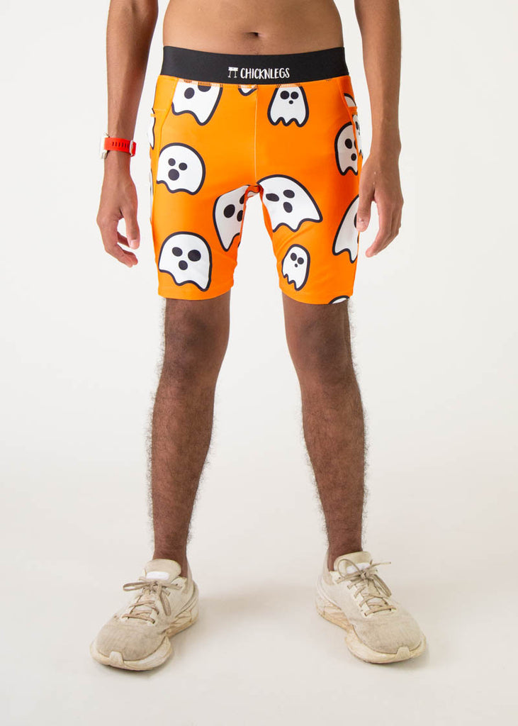 Model is a runner wearing Chicknlegs men's 8 inch half tights in the Ghosts design, facing front.