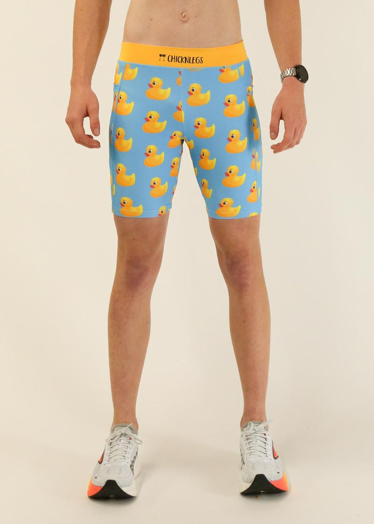 Model wearing Chicknlegs men's 8 inch half tights in the rubber ducky design facing front.