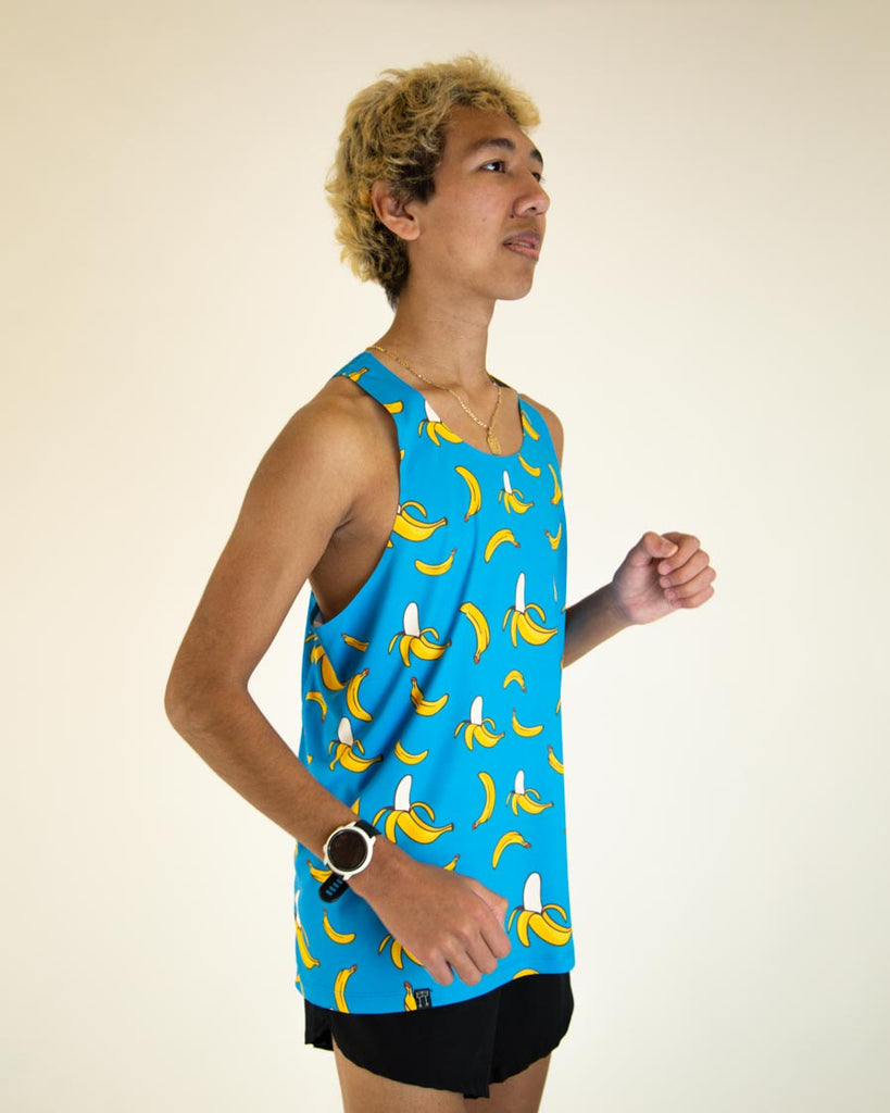 Runner is wearing ChicknLegs men's performance singlet in the blue banana design.