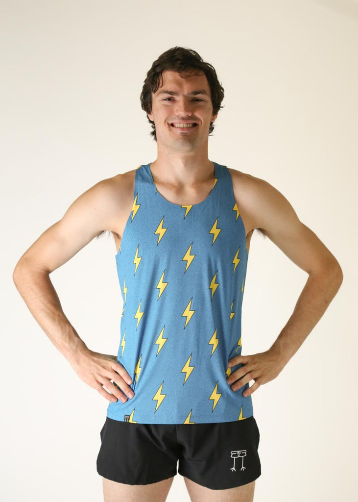 Model wearing Chicknlegs Men's peformance singlet wearing the blue bolts design front view.