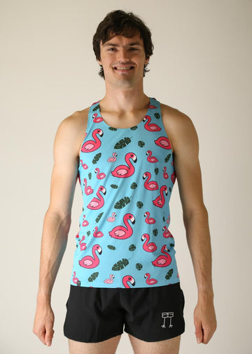 Model wearing men's performance singlet wearing blue flamingo design facing front.