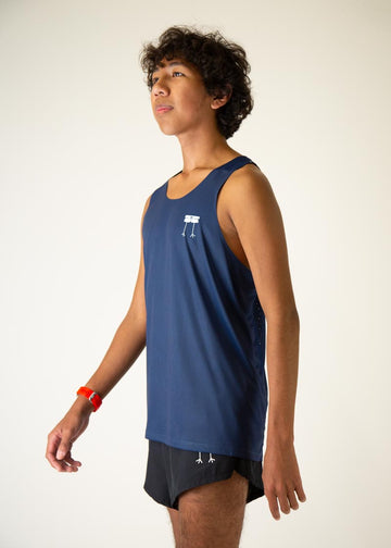 The model is a runner who is wearing Chicknlegs men's running performance singlet in the navy design, facing left.