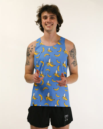 Runner is wearing ChicknLegs in the men's performance singlet in the blue banana design. The print has yellow bananas on it with a blue background.