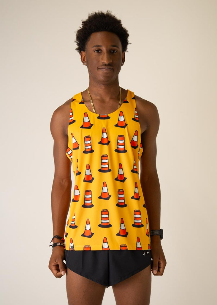 Model is wearing Chicknlegs men's runner singlet in the Traffic Cones design, facing front.