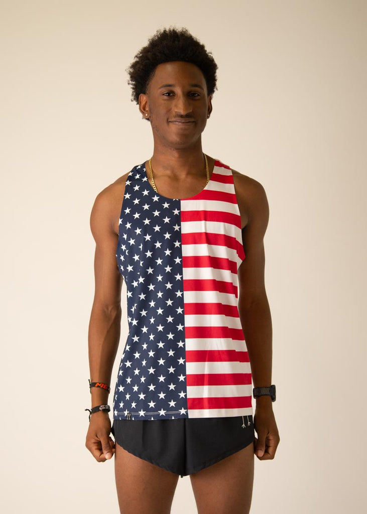 Model is wearing Chicknlegs men's runner singlet in the USA design, facing front.