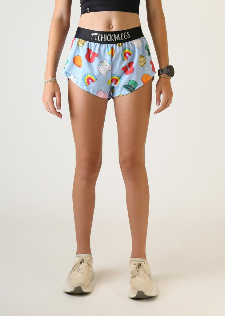 Model wearing Chicknlegs women's 1.5 inch split running shorts in the charms design front view