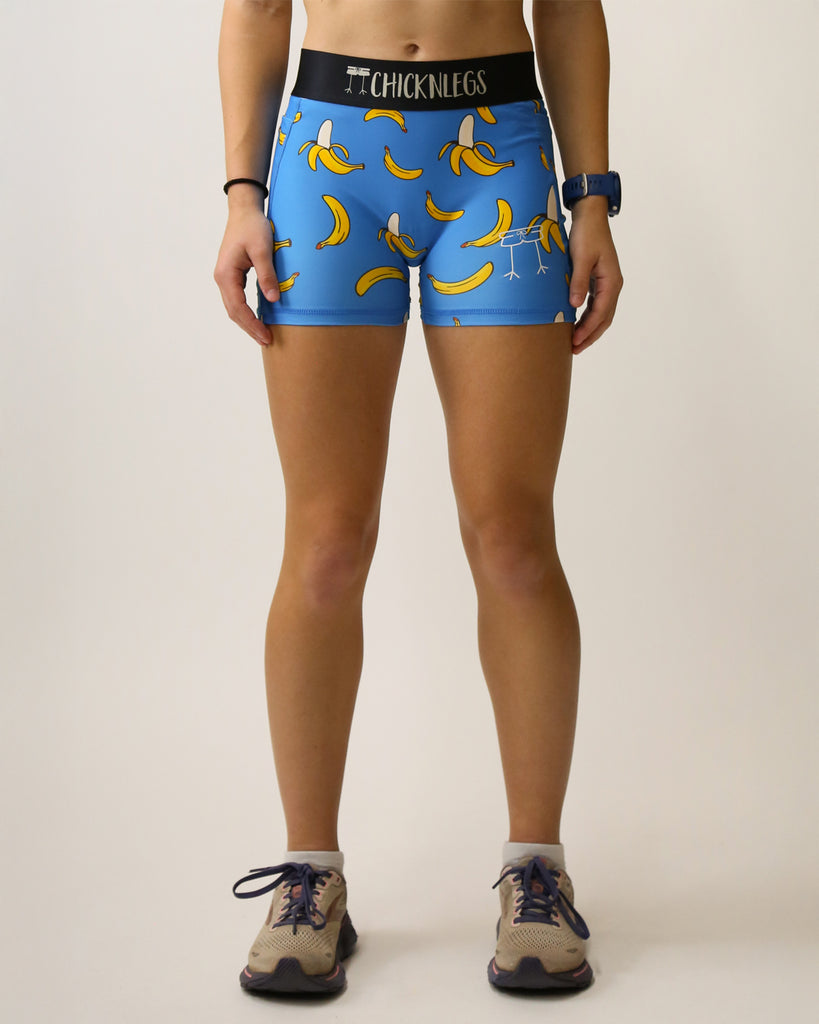 Runner is wearing ChicknLegs in the women's 3 in compression spandex shorts with the blue banana design. The print has yellow bananas on it with a blue background.