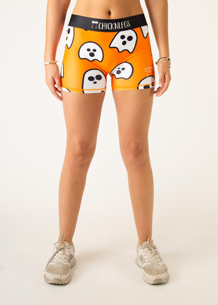 Model is a runner wearing Chicknlegs women's 3" compression shorts in the Ghost design, facing front.