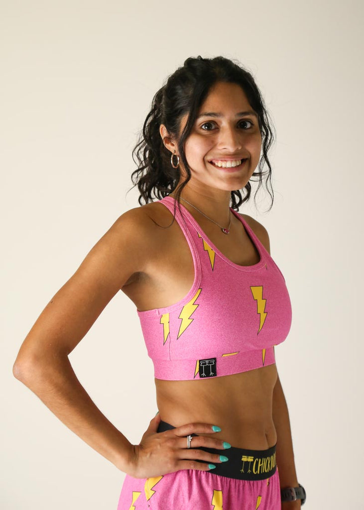 Side view of the ChicknLegs pink bolts OG sports bra.