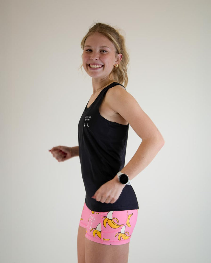 Runner is wearing ChicknLegs in the women's performance singlet in the solid black design. Great for those sleek looks.