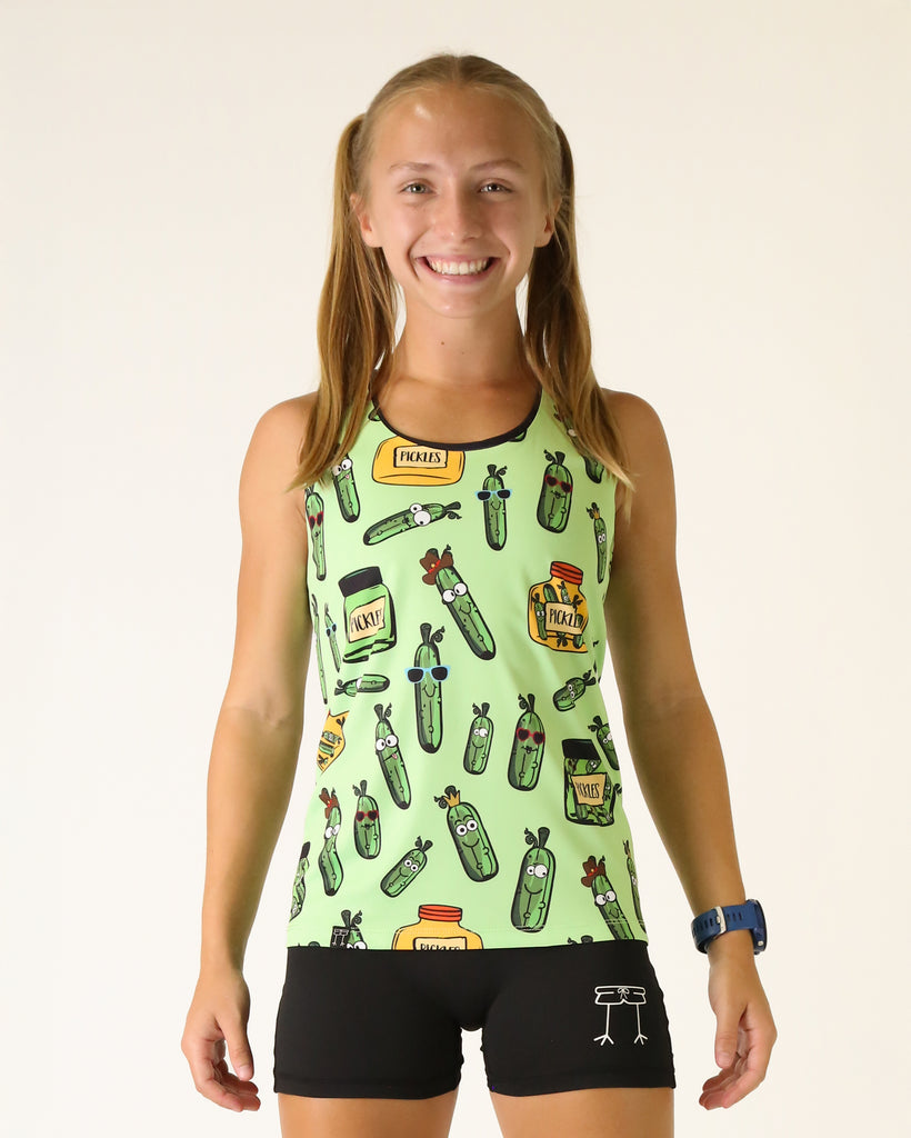 Runner is wearing ChicknLegs in the women's performance running singlet in the pickles design. The print has a bunch of pickles all over it and in jars that are yellow and green.