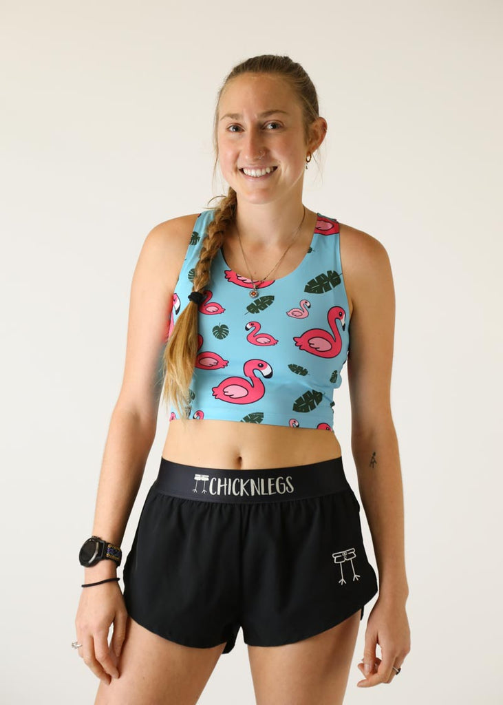Front view of runner wearing the women's Blue Flamingo PWR Crop Top from ChicknLegs.