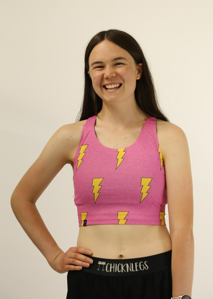 Front view of the pink bolts PWR crop top from ChicknLegs.