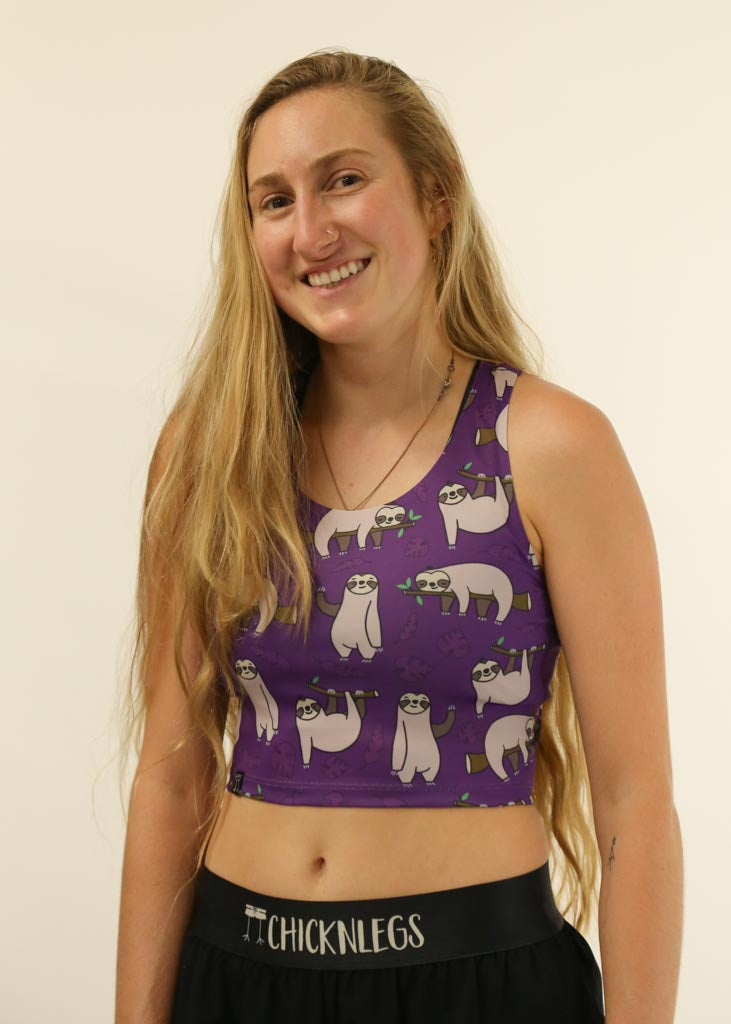 Front view of runner wearing the women's sloths PWR crop top from ChicknLegs.