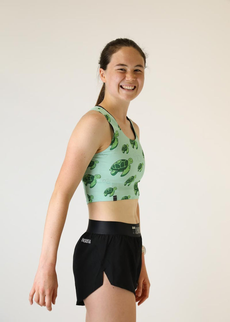 Side view of the Women's Sea Turtles PWR Crop Top.