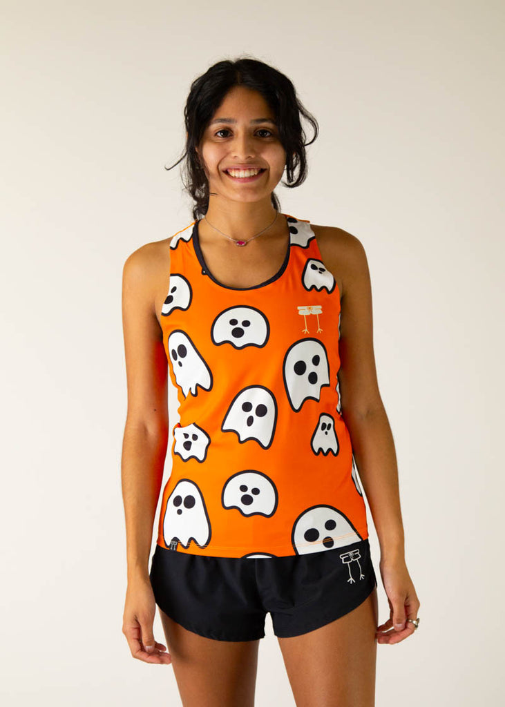 The model is a runner wearing chicknlegs women's runners singlet in the ghost design, facing front.