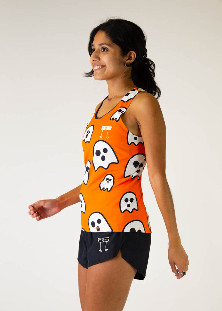 The model is a runner wearing chicknlegs women's runners singlet in the ghost design, facing left.