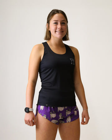 Runner is wearing ChicknLegs in the women's performance singlet in the solid black design.